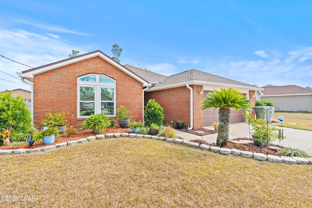 ranch-style house with a garage, a front yard, and brick siding