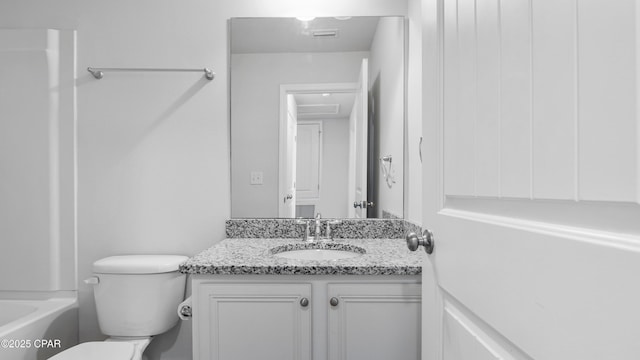 bathroom featuring toilet, a washtub, walk in shower, and vanity