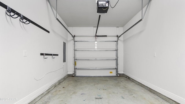 garage with electric panel, baseboards, and a garage door opener