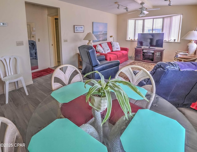 423 Snook Ln, Panama City Beach, FL 32408 - living room featuring lofted ceiling with beams, rail lighting, and ceiling fan