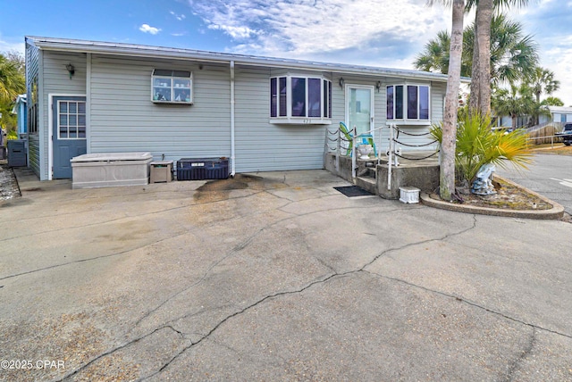 423 Snook Ln, Panama City Beach, FL 32408 - rear view of house featuring central AC unit