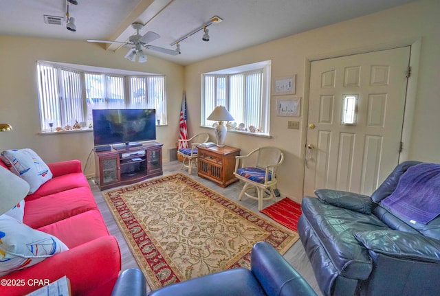 423 Snook Ln, Panama City Beach, FL 32408 - living room featuring hardwood / wood-style flooring, lofted ceiling with beams, rail lighting, and ceiling fan