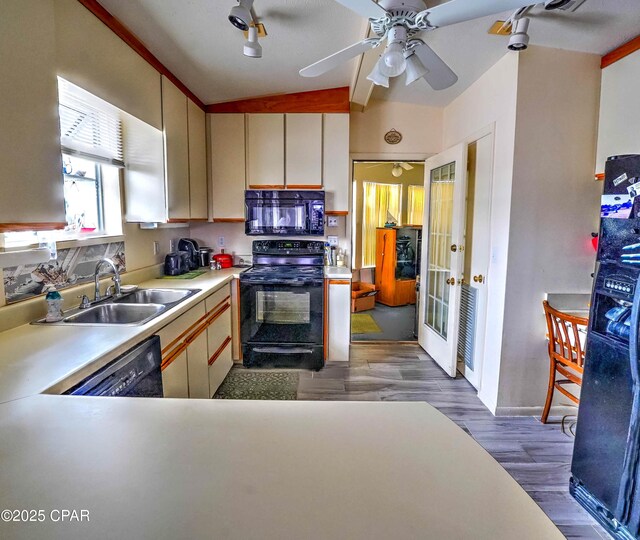 423 Snook Ln, Panama City Beach, FL 32408 - kitchen featuring sink, ceiling fan, dark hardwood / wood-style floors, black appliances, and kitchen peninsula