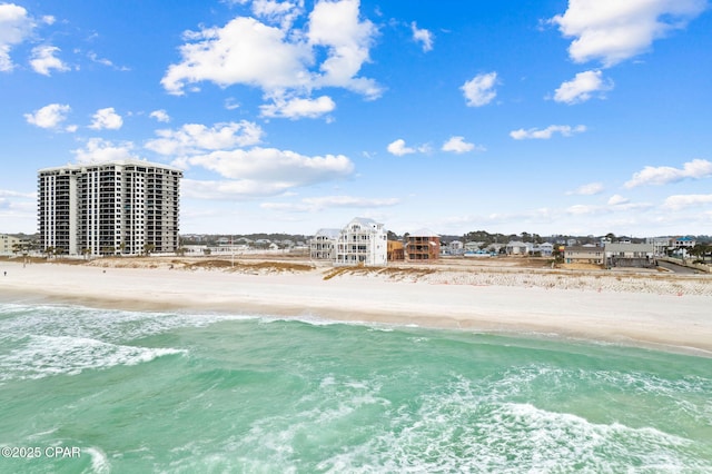 aerial view with a water view and a view of the beach