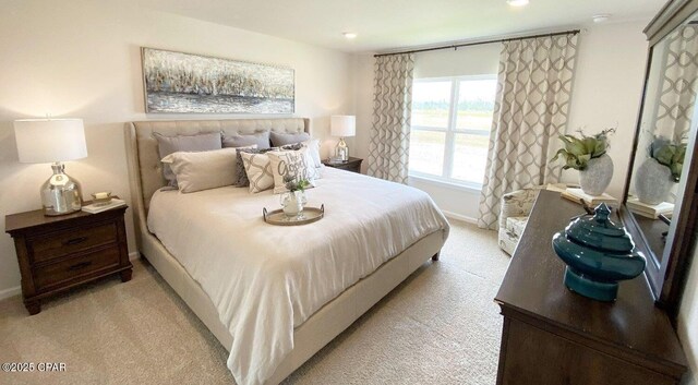 bedroom featuring light colored carpet