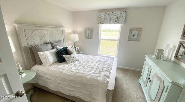 bedroom featuring light colored carpet