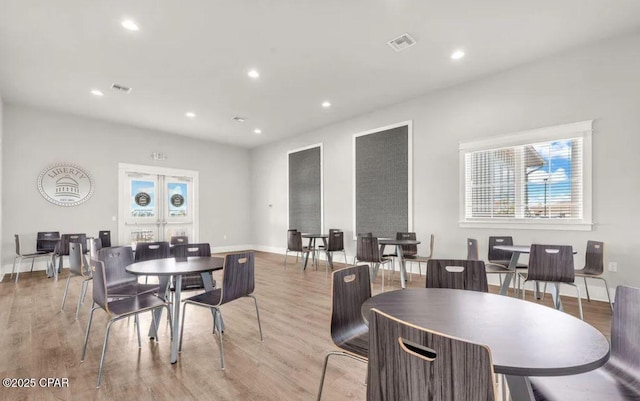 dining area featuring light wood-type flooring