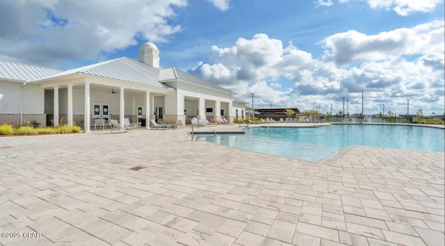 view of swimming pool featuring a patio