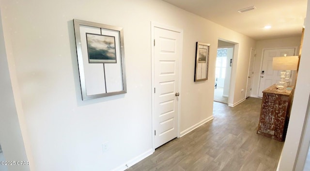 hallway featuring wood-type flooring