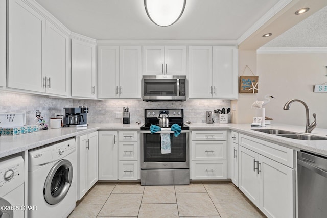 kitchen featuring a sink, white cabinets, ornamental molding, appliances with stainless steel finishes, and backsplash