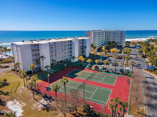 birds eye view of property with a beach view and a water view