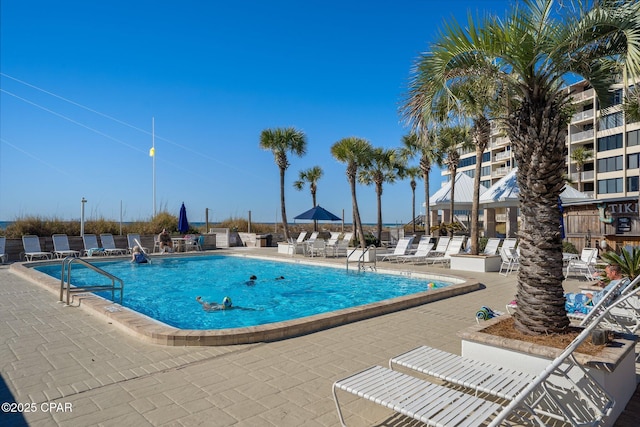 pool featuring a patio area and a pergola