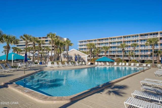 community pool with a patio area