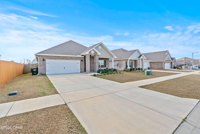 view of front of property featuring a front yard and a garage