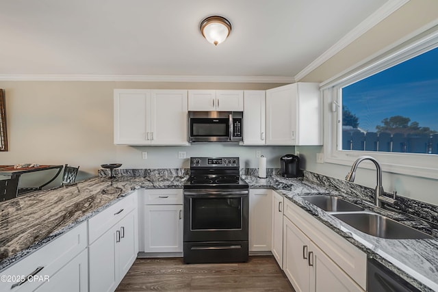 kitchen with white cabinetry, black dishwasher, sink, and electric range oven