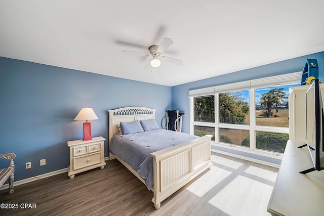 bedroom with hardwood / wood-style floors and ceiling fan