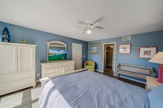 bedroom with hardwood / wood-style flooring and ceiling fan