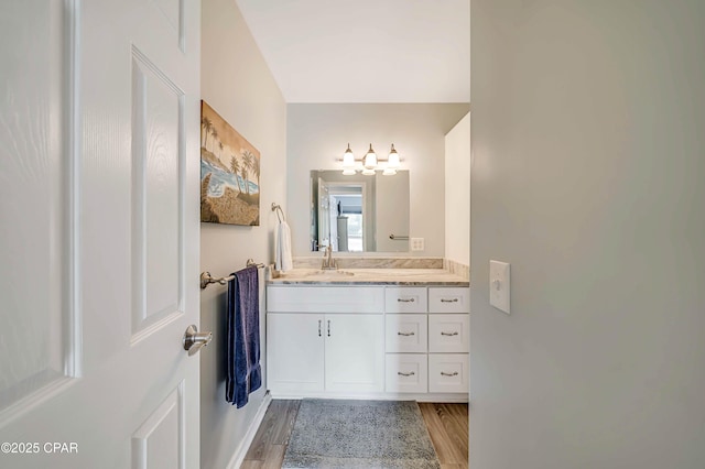 bathroom with vanity and wood-type flooring