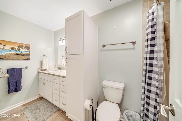 bathroom featuring hardwood / wood-style flooring, vanity, and toilet