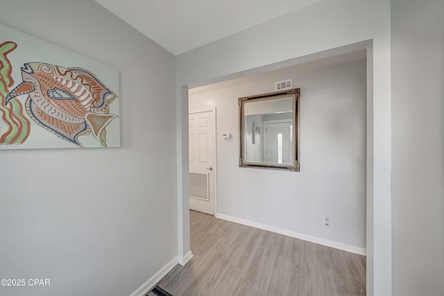 hallway with light wood-type flooring