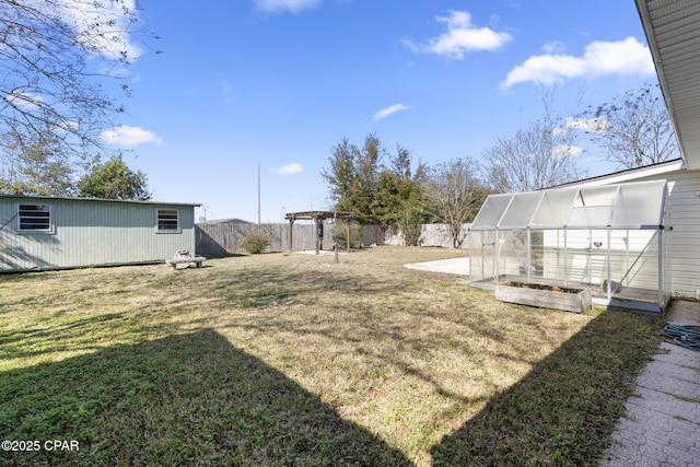 view of yard with an outbuilding and a pergola