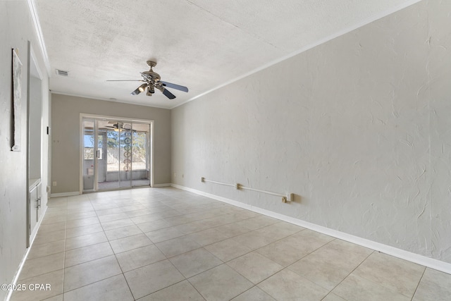 tiled empty room featuring crown molding, ceiling fan, and a textured ceiling