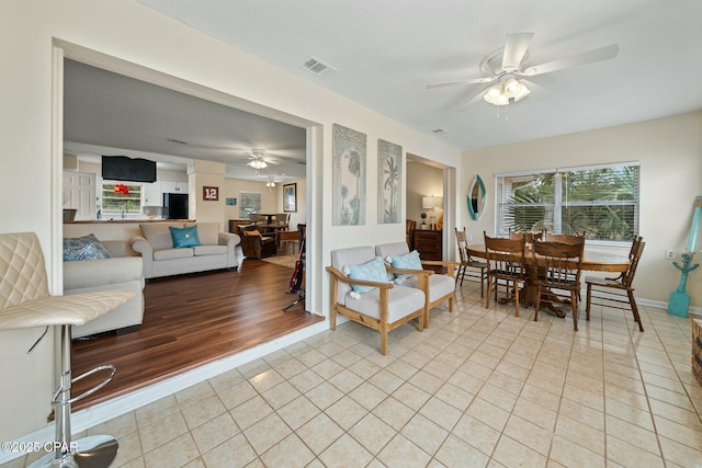 dining room featuring ceiling fan and light tile patterned floors