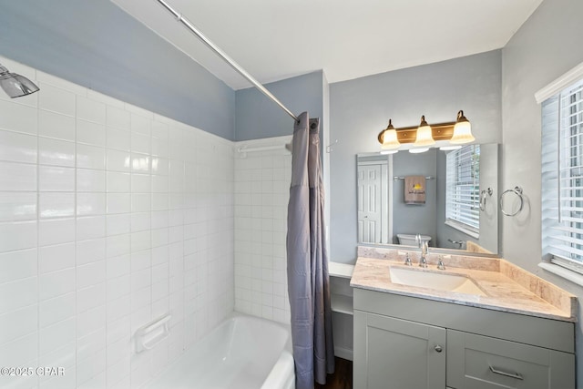 full bathroom featuring vanity, toilet, and shower / bath combo