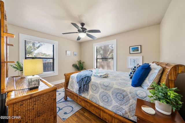 bedroom with wood-type flooring and ceiling fan