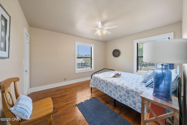 bedroom featuring dark wood-type flooring and ceiling fan