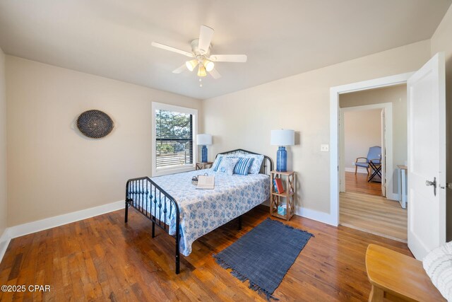 bedroom featuring hardwood / wood-style flooring and ceiling fan