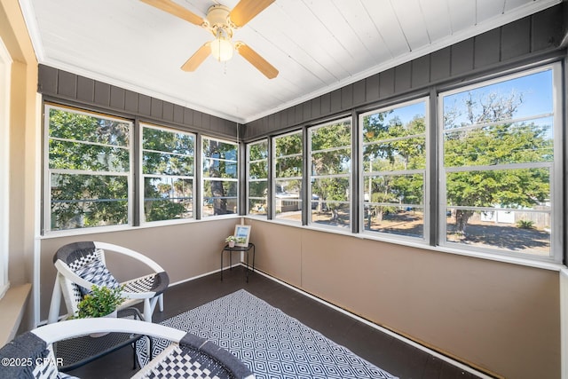 sunroom / solarium with plenty of natural light and ceiling fan