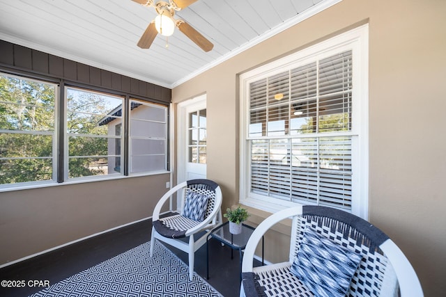 sunroom / solarium featuring wood ceiling and ceiling fan