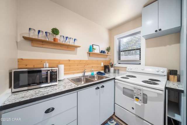 kitchen with sink and white electric range