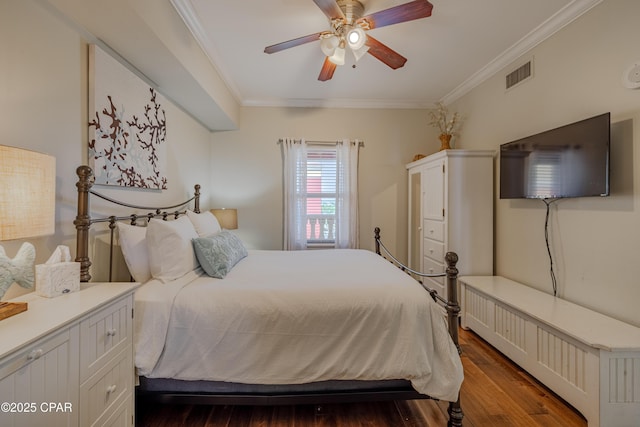 bedroom featuring a ceiling fan, dark wood-style flooring, visible vents, and crown molding