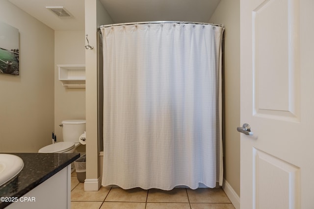 bathroom with a shower with curtain, vanity, visible vents, and tile patterned floors