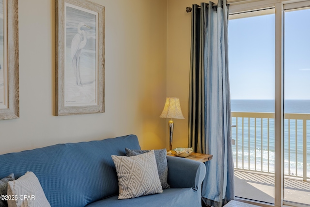 living area featuring a water view