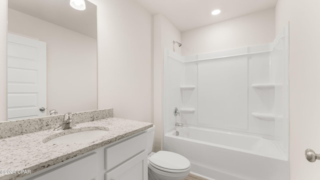 bathroom with recessed lighting, toilet, vanity, and bathtub / shower combination