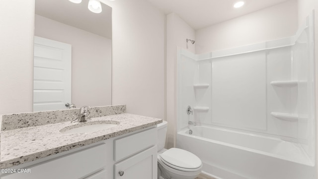 bathroom featuring tub / shower combination, toilet, and vanity