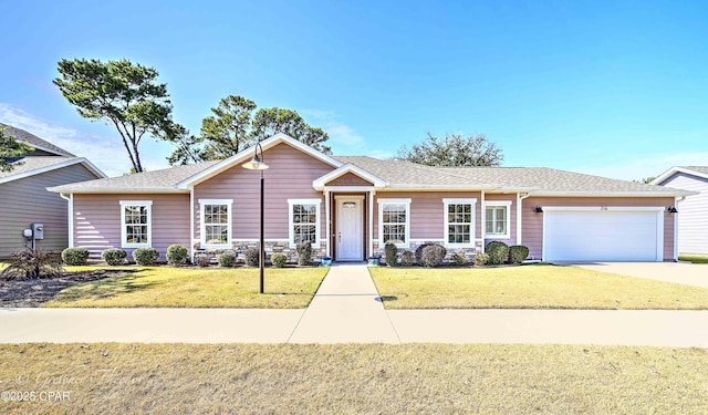 single story home featuring a garage, concrete driveway, a shingled roof, and a front yard