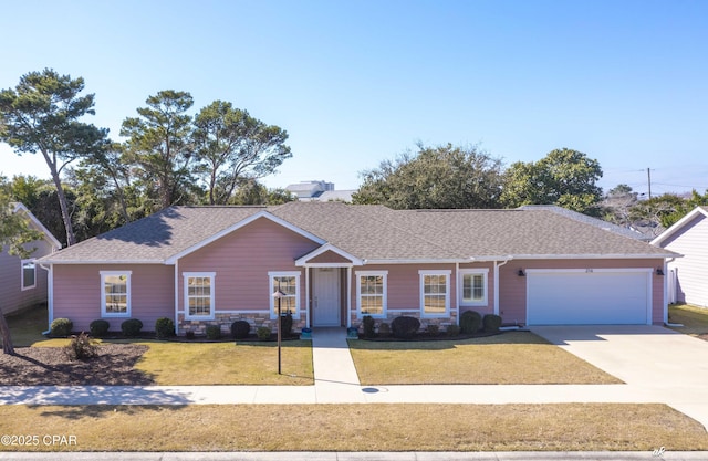 single story home featuring a shingled roof, an attached garage, stone siding, driveway, and a front lawn