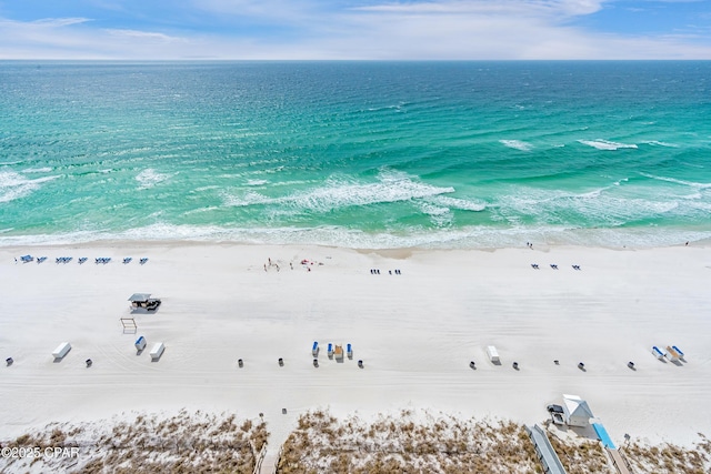 bird's eye view featuring a water view and a view of the beach