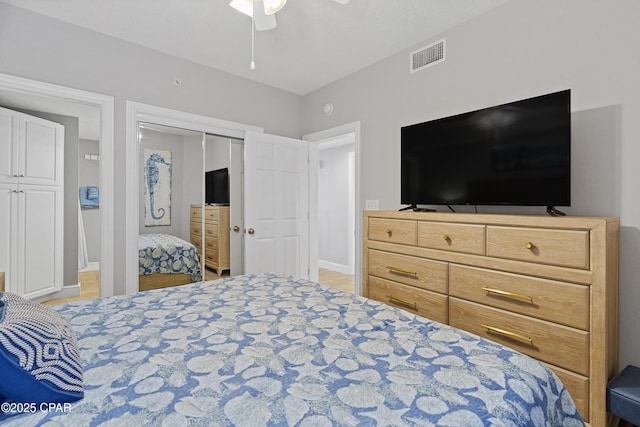 bedroom featuring visible vents, baseboards, a closet, and ceiling fan