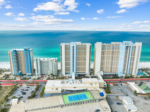 birds eye view of property with a water view and a view of city