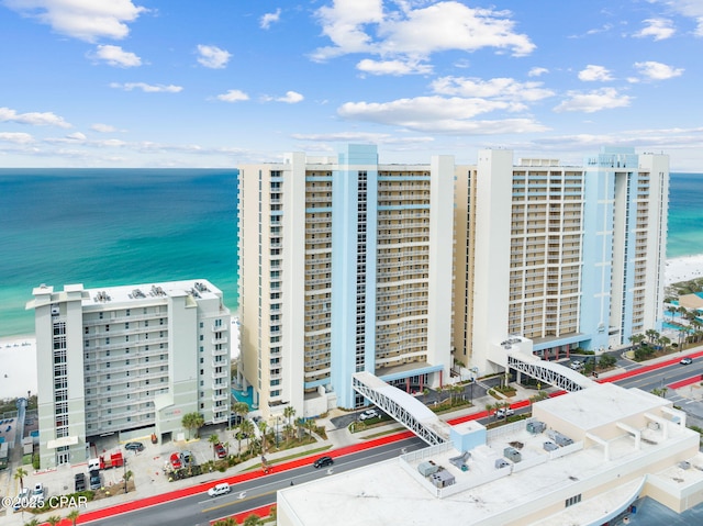 drone / aerial view featuring a water view and a view of city