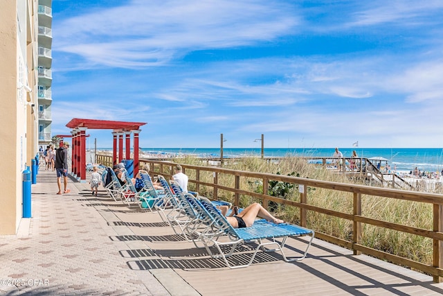 exterior space with a beach view and a water view