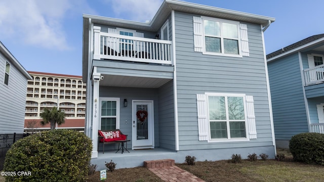 view of front of house with a balcony