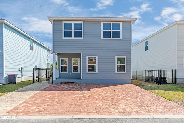 back of property featuring a patio and fence