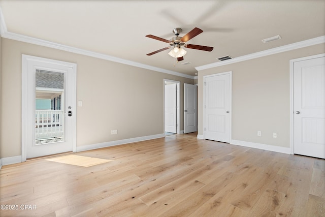 unfurnished bedroom featuring two closets, ornamental molding, visible vents, light wood finished floors, and baseboards