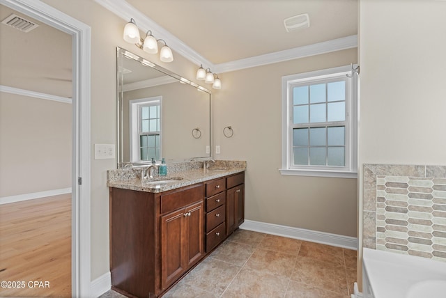full bathroom featuring a sink, visible vents, double vanity, and crown molding